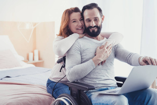 Emotional couple smiling and dreaming about living in a comfortable house - Foto, Bild