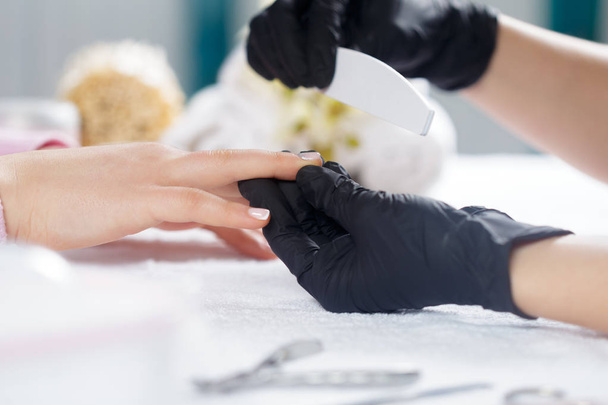 professional manicure for woman in salon, closeup - Фото, зображення