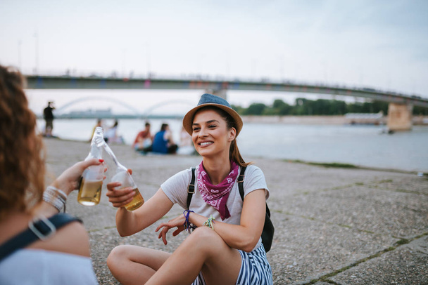 Beautiful girls toast outdoors in the summer. - Photo, Image