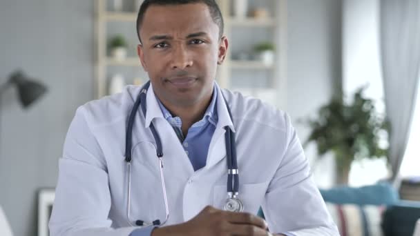 No, Rejecting African-American Doctor Looking at Camera in Clinic - Video