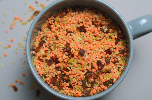 Lentil and Bulgur Mix with Dried Herbs and Spices on Grey Background - Photo, Image