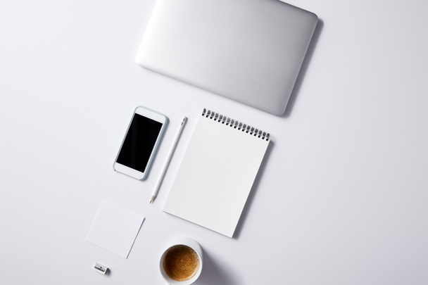 top view of arranged various business workplace objects on white tabletop for mockup - Foto, Imagem