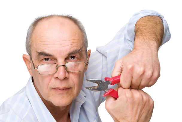 Serious man with pliers - Photo, image
