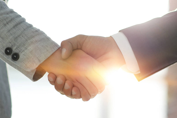 Business people shaking hands isolated on white background - Fotó, kép