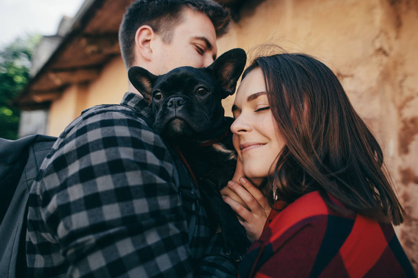 Loving couple with pet french bulldog - Fotografie, Obrázek