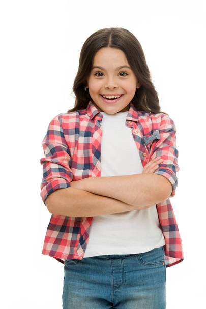 Happy child keep arms crossed isolated on white. Little girl with cute smile and brunette hair. Casual look and fashion. Beauty salon. I am a fashion girl - Foto, Bild