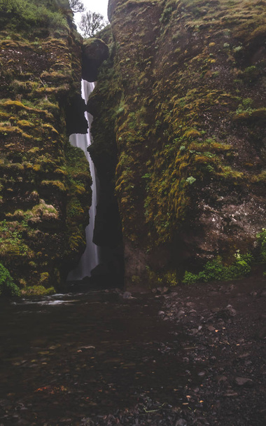 gljufrabui secret waterfall in iceland covered by rocks with moss water - Φωτογραφία, εικόνα