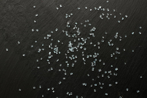 Blue sugar crystals on slate board - Zdjęcie, obraz