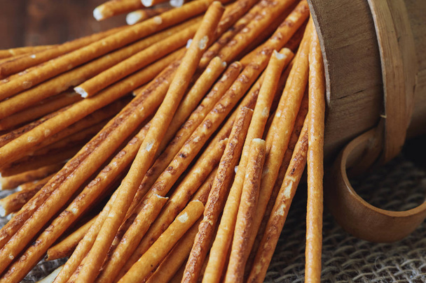 Group of salted pretzel sticks scattered around the table - Photo, Image