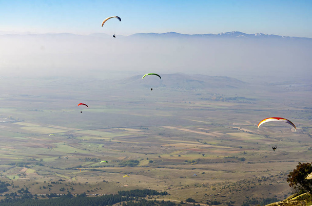 paragliders flying over valley in summer sunny day - Φωτογραφία, εικόνα