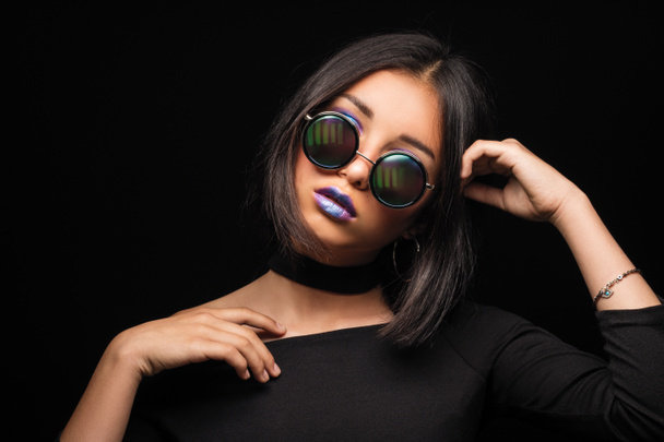 Portrait of cool crazy brunette fashionable girl in sunglasses, casual hairdo on black background. Woman like bitch with pretty makeup big lips - Photo, Image