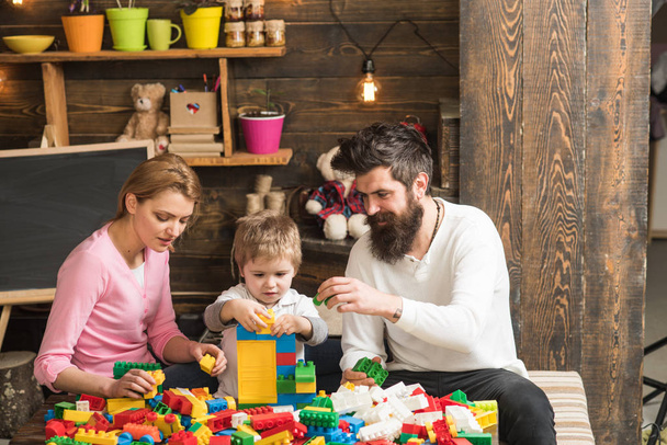 Family concept. Family play with colorful bricks. Family build structure with toy bricks. Family love and trust - Foto, Bild