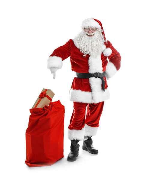Authentic Santa Claus with red bag full of gifts on white background - Foto, Bild