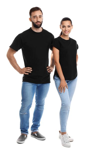 Young couple in t-shirts on white background. Mockup for design - Fotografie, Obrázek