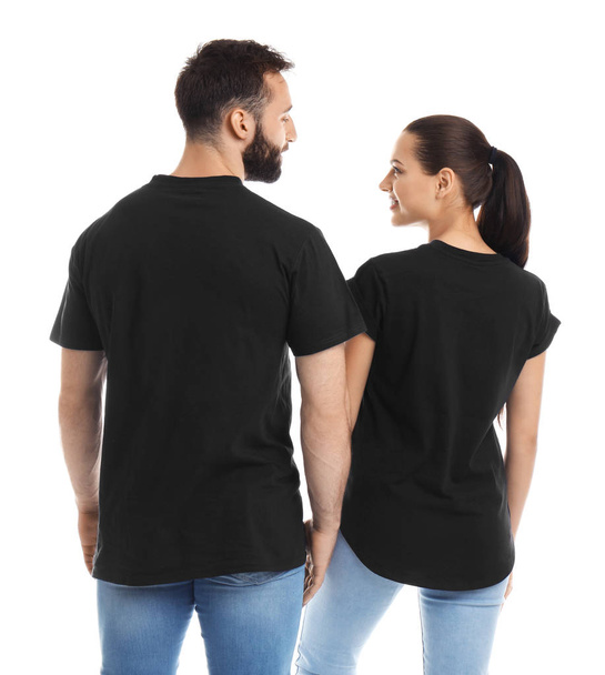 Young couple in t-shirts on white background. Mockup for design - Foto, immagini