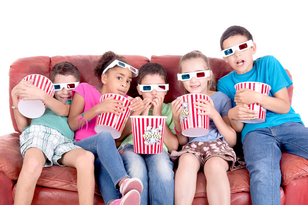 little kids watching movies with 3d glasses - Foto, imagen