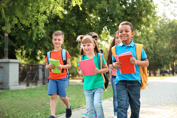 Cute little children with backpacks going to school - Foto, Imagem