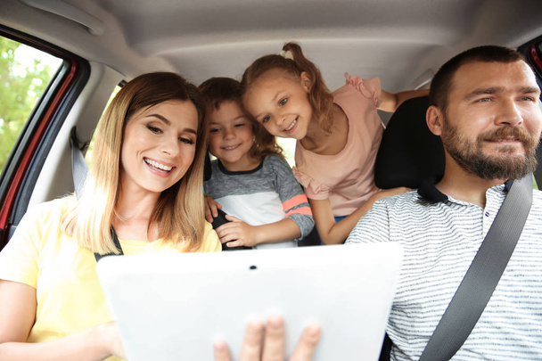 Happy family with children taking road trip together - Photo, image