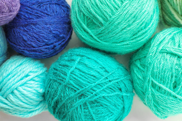 Colorful knitting yarn on white background, closeup - Foto, imagen