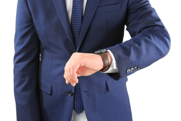 Man with wrist watch against on white background. Time management concept - Fotó, kép
