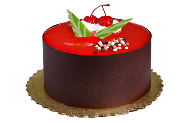 Csokoládé torta tetején két meggy - Fotó, kép