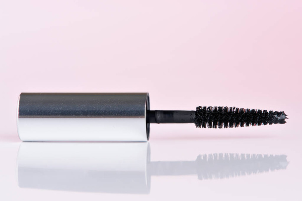 Black mascara with reflection with pink - Photo, Image