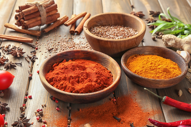 Various spices on wooden table - Zdjęcie, obraz