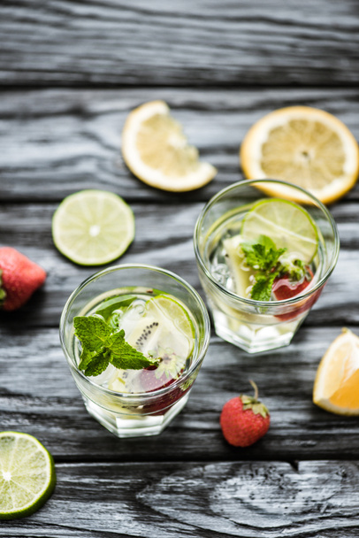 high angle view of delicious summer cocktail in glasses on wooden table - Foto, afbeelding