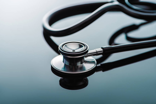 selective focus of stethoscope on glass surface  - Photo, Image