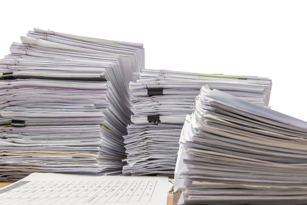 documents on desk stack up high waiting to be managed isolate on white background. - Photo, Image