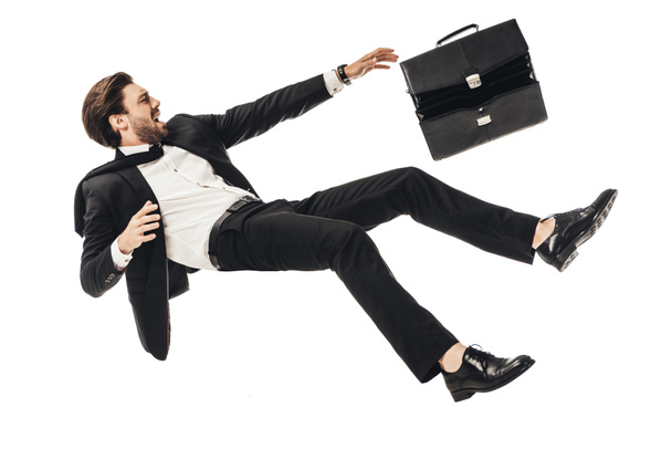 кричить молодий бізнесмен падає з портфелем ізольовано на білому
 - Фото, зображення