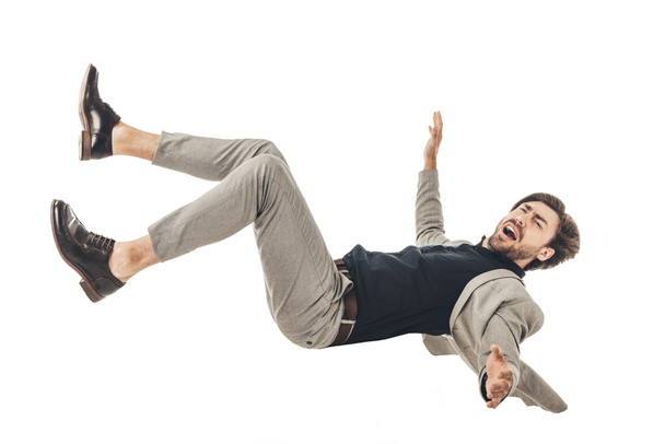 shouting young businessman in suit falling isolated on white - Фото, зображення