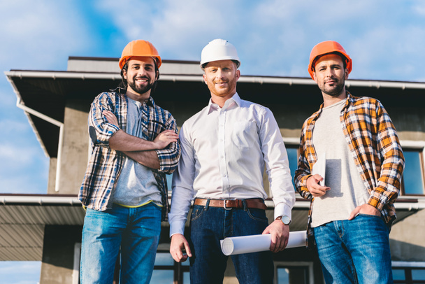 group of handsome architects in front of construction site - Φωτογραφία, εικόνα