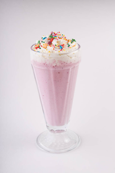 Glass of milk shake smoothie on a white background - 写真・画像