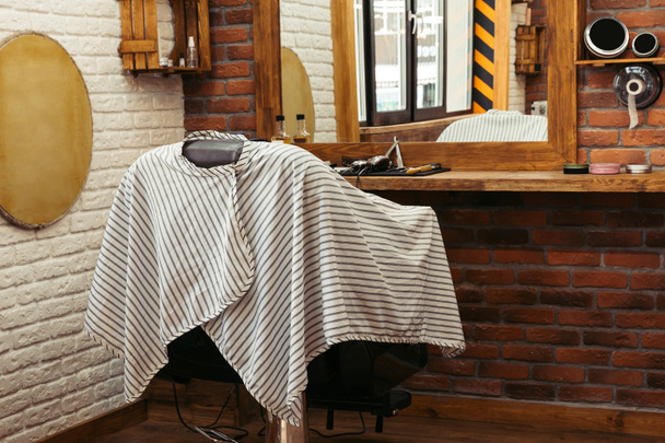 empty chair at modern barber shop interior - Фото, зображення
