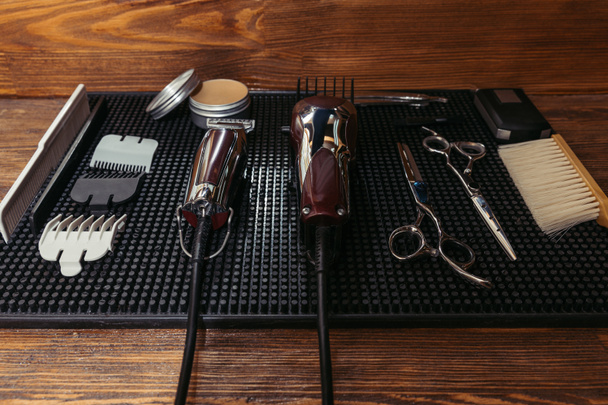electric clippers, professional scissors and hair wax in barbershop - Photo, Image