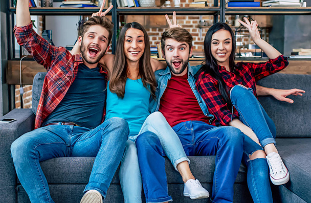 Group of young happy friends posing in living room - Photo, Image
