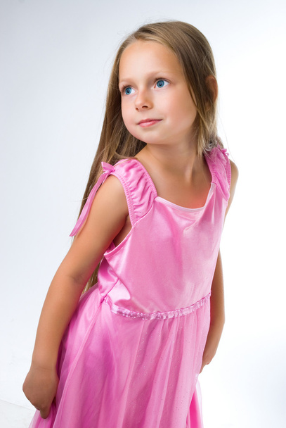 Blond girl stand in pink dress - Фото, зображення
