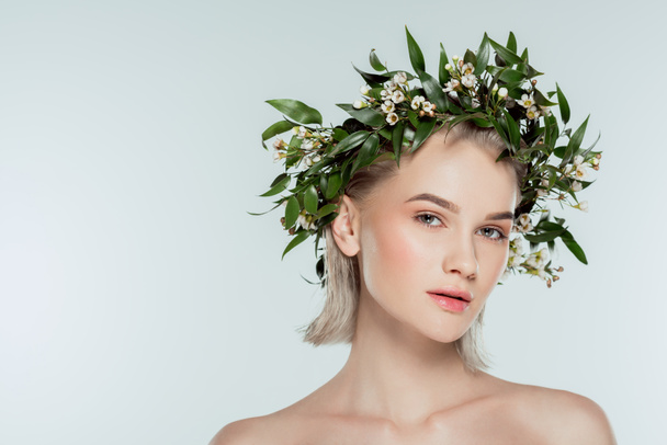 attractive blonde girl in floral wreath, isolated on grey - Zdjęcie, obraz
