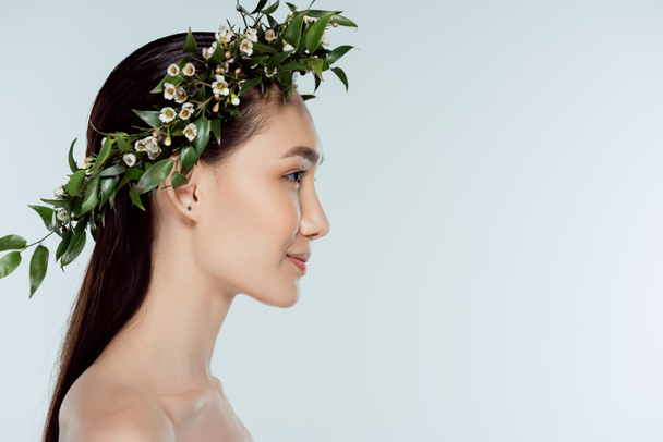 profile portrait of naked asian girl in floral wreath, isolated on grey - Zdjęcie, obraz