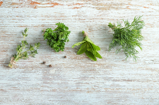 Different fresh herbs and spices on wooden background - Zdjęcie, obraz