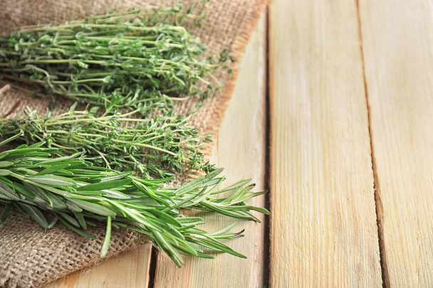 Different fresh herbs on wooden background - Фото, зображення
