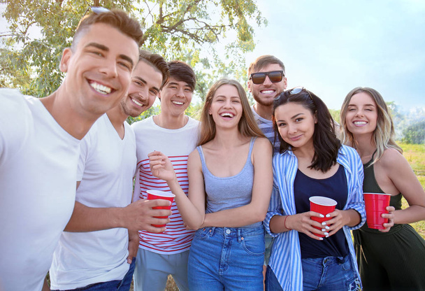 Group of attractive young people taking selfie outdoors - Photo, Image