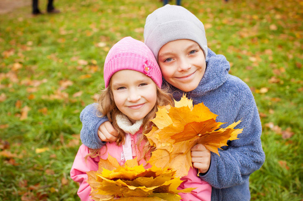 Children at autumn. Girls and boy outdoors - Foto, Imagem
