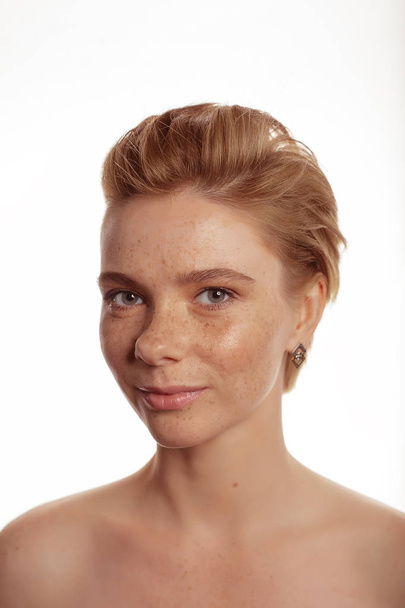 Young beautiful freckles woman face portrait with healthy skin - 写真・画像