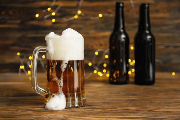 Glass mug with cold beer on wooden table - Photo, Image