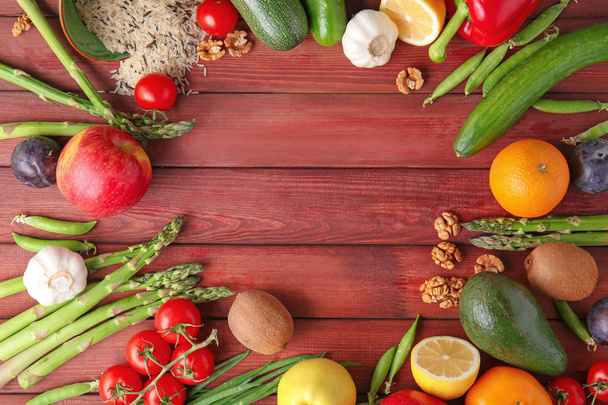 Frame made of various healthy products on wooden background - Photo, Image