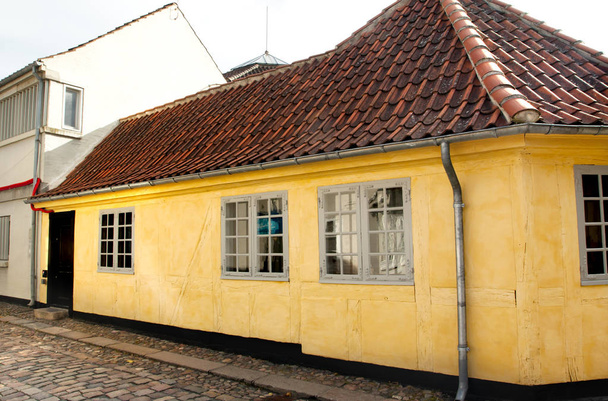 Old town of Odense, Denmark. HC Andersen's hometown. Yellow house is the birthplace of Hans Christian Andersen. - Photo, Image