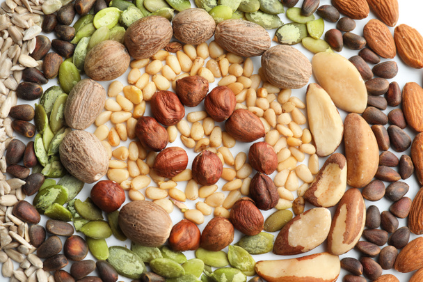 Composition with different nuts on white background, top view - Photo, Image