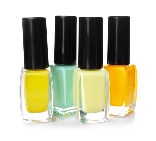 Bottles of colorful nail polishes on white background - Photo, Image